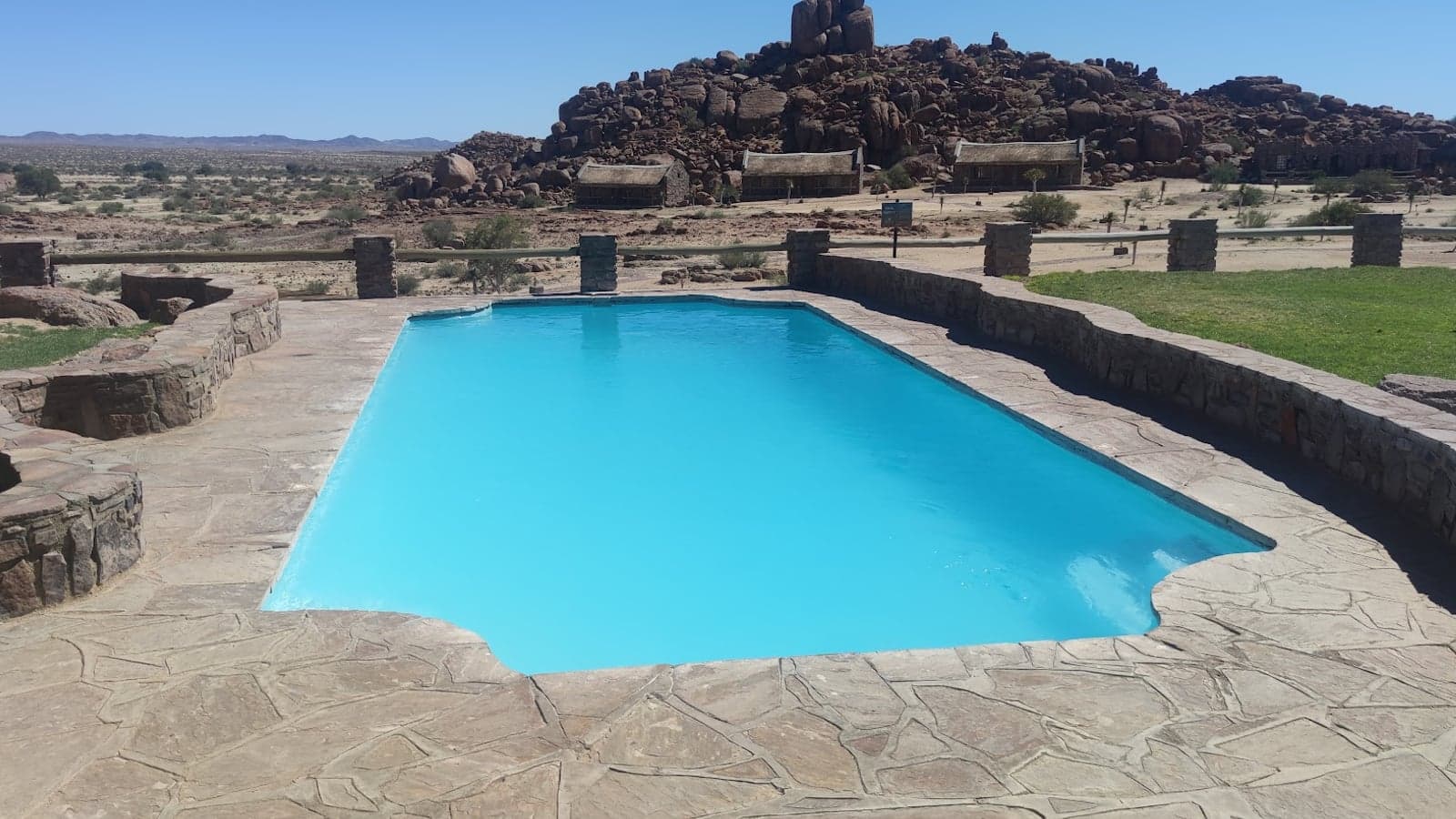 Stone-and-thatch chalets around the pool at Canyon Village, Fish River Canyon