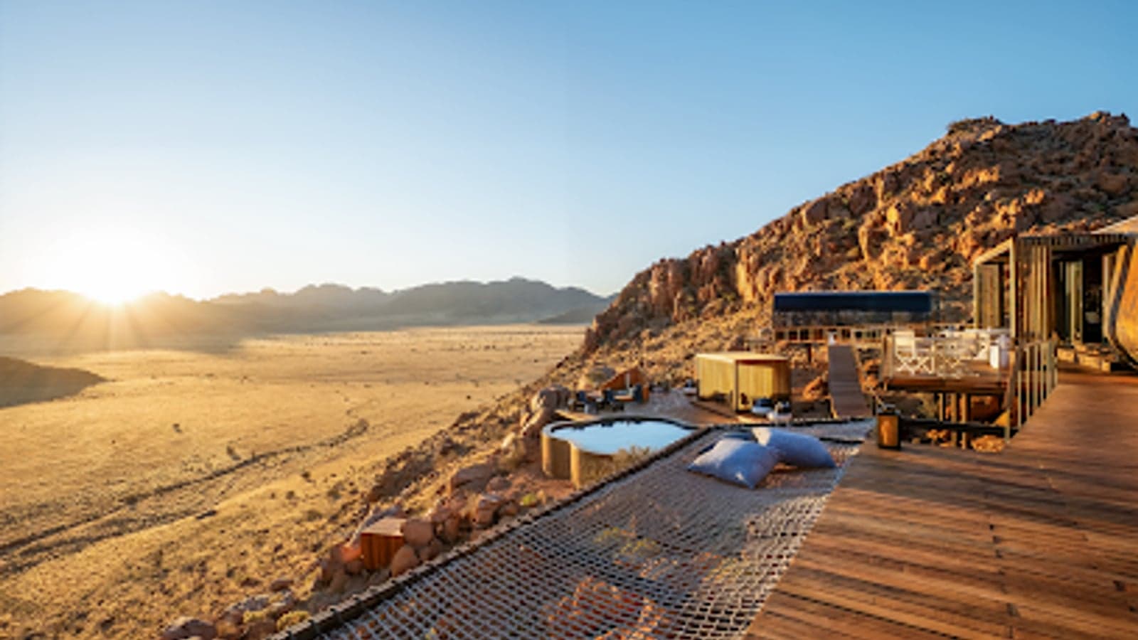 A private deck and plunge pool at sunrise at Luna Namib Collection, Sossusvlei