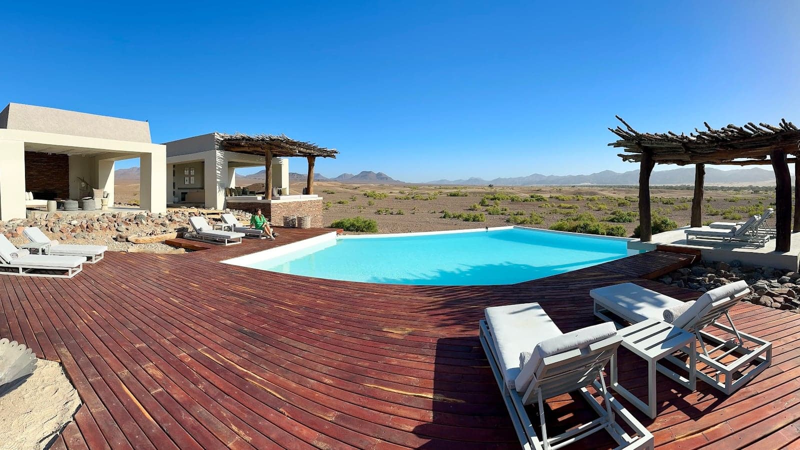 The infinity pool and desert mountain view at Okahirongo Elephant Lodge, Purros